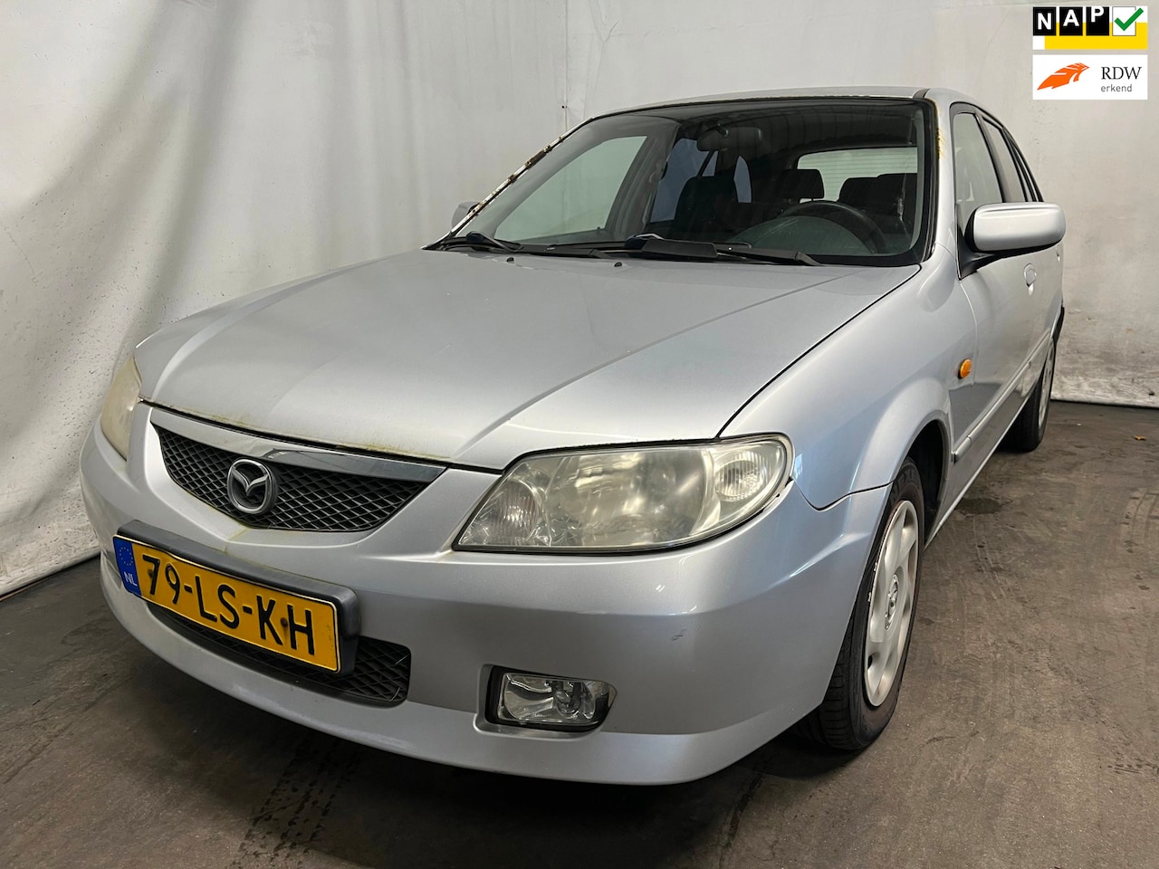 Mazda 323 Fastbreak - 1.6i Exclusive - Linksachter schade - Roest - Schade - AutoWereld.nl