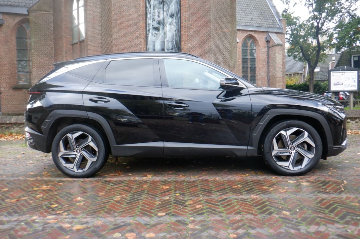 Hyundai Tucson - 1.6 T-GDi HEV 230pk Aut. i-Motion LEER-STOELVERW/VENTIL.-PAN.DAK-BOVAG - AutoWereld.nl