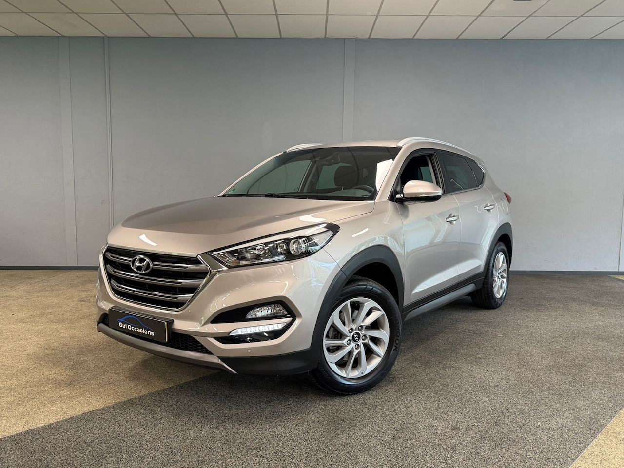 Hyundai Tucson - 1.6 GDi Comfort|TREKHAAK|CAMERA|STOELVERW|NAVI|PDC|CRUISE - AutoWereld.nl