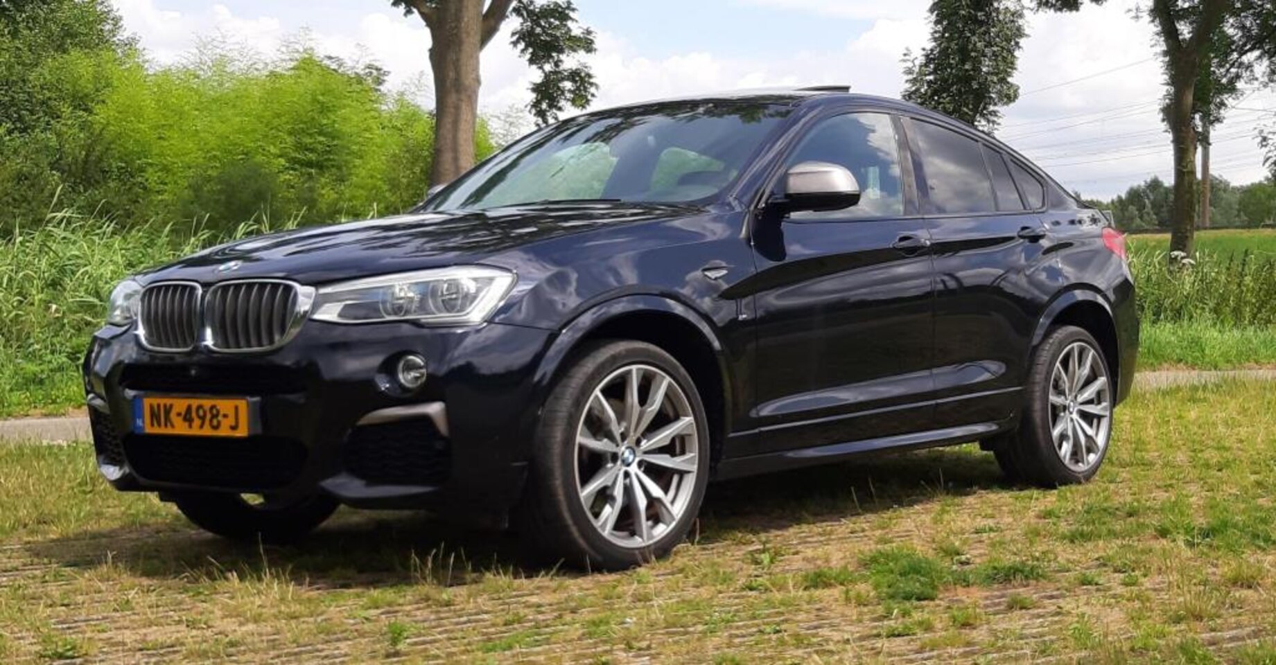 BMW X4 - M4.0i Centennial High Executive M40i Centennial High Executive - AutoWereld.nl