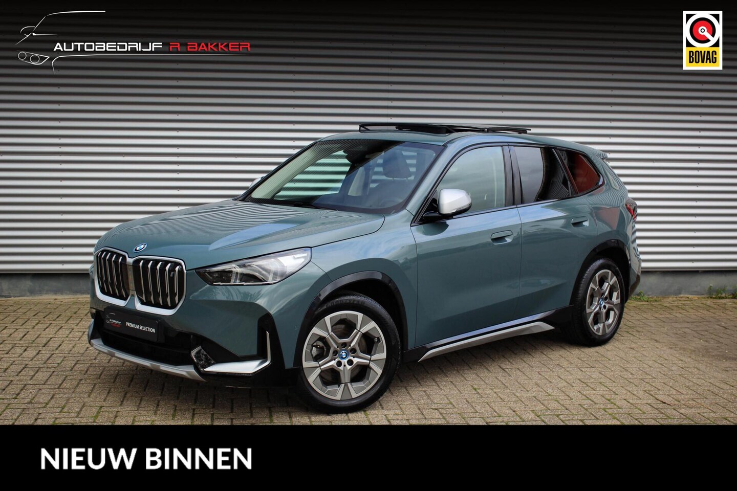 BMW iX1 - xDrive30 67 kWh X-Line // 100% SoH | Cape York Green | Panoramadak | Leder | Camera | Stoe - AutoWereld.nl