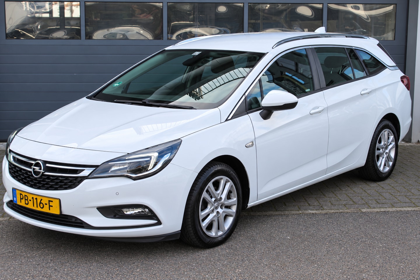 Opel Astra Sports Tourer - 1.0 Online Edition Airco, Carplay, PDC, Bluetooth, DAB, Trekhaak, Apk t/m 5-27! - AutoWereld.nl