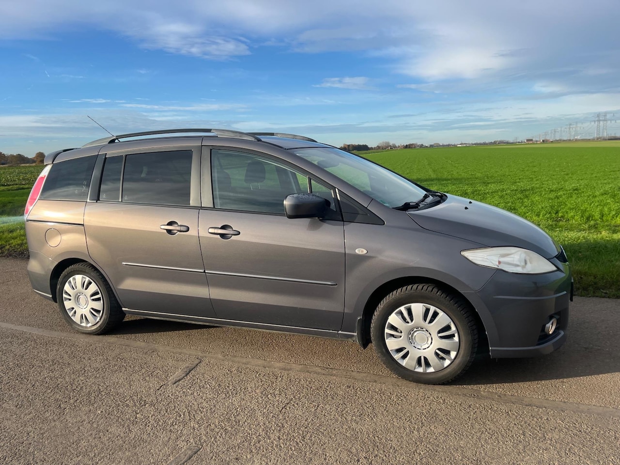 Mazda 5 - 2.0 Business / 7 pers (tik in motor) - AutoWereld.nl