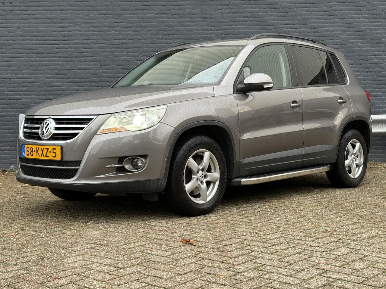 Volkswagen Tiguan - 1.4 TSI Comfort&Design | Climate | Navi | PDC | Trekhaak | - AutoWereld.nl
