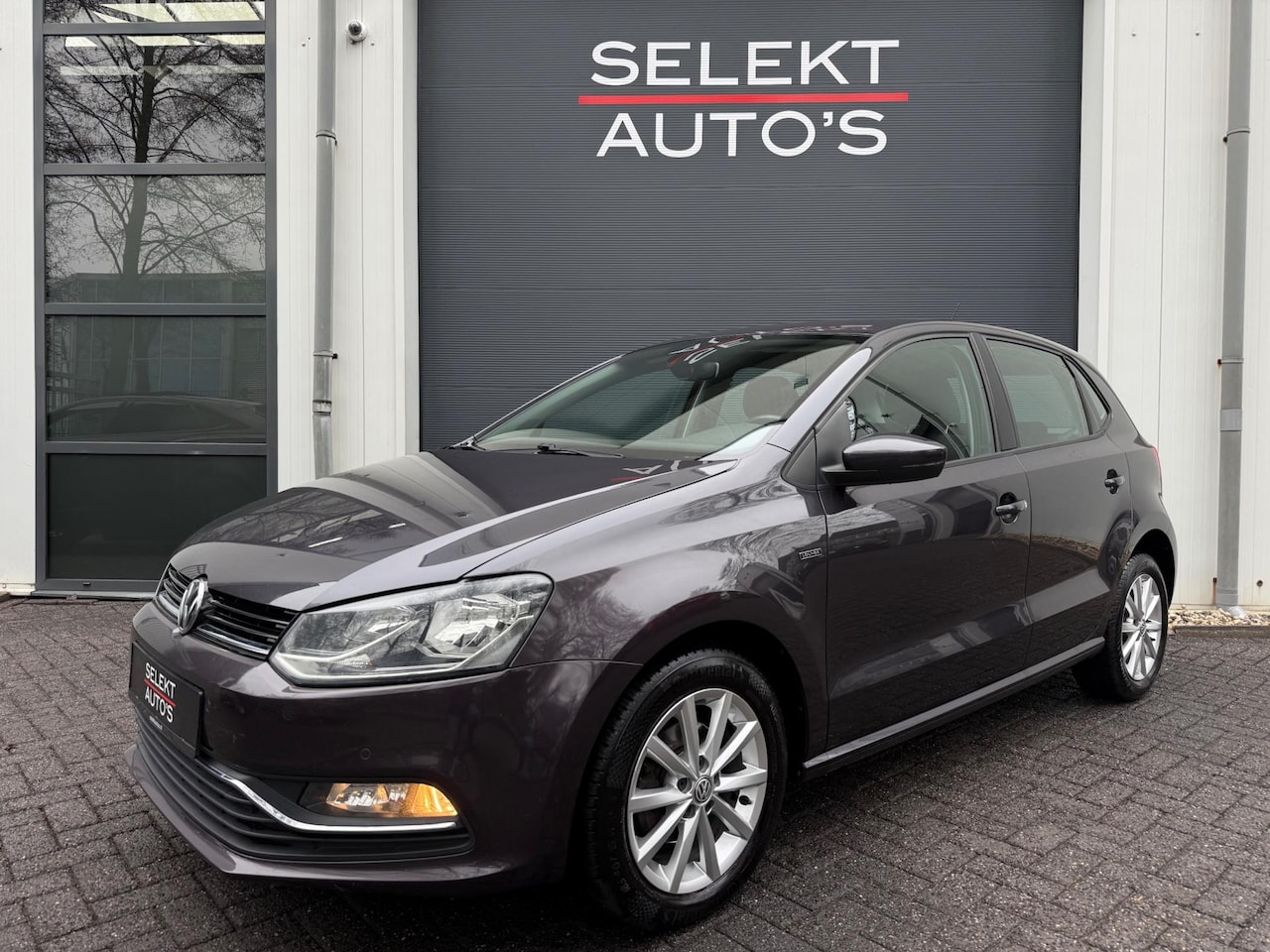 Volkswagen Polo - 1.2 TSI Lounge 90 Pk DSG Cruise/Climate/Navigatie/Bluetooth/PDC/Elekt Ramen/Elekt Spiegels - AutoWereld.nl