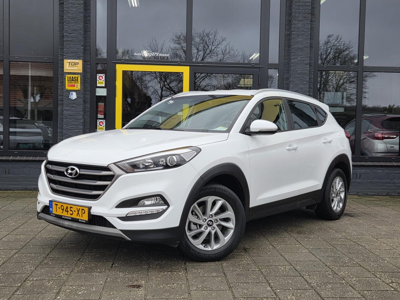 Hyundai Tucson - 1.6 GDi i-Motion | Park. Camera | Stoelverwarming | Tel | Navi| Cruise Control | Park Sens - AutoWereld.nl