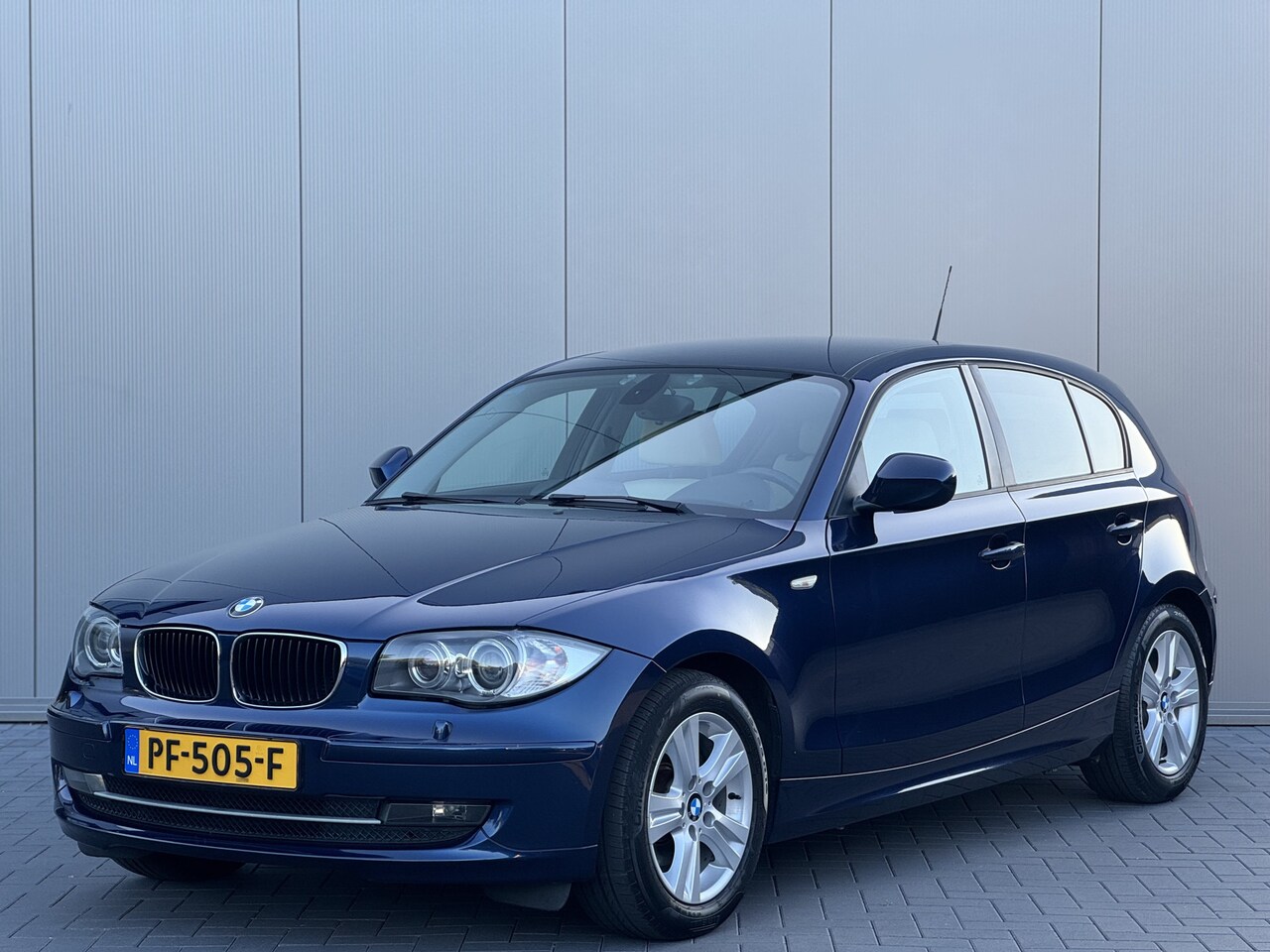 BMW 1-serie - 118i High Executive | Xenon | Leder | Navigatie - AutoWereld.nl