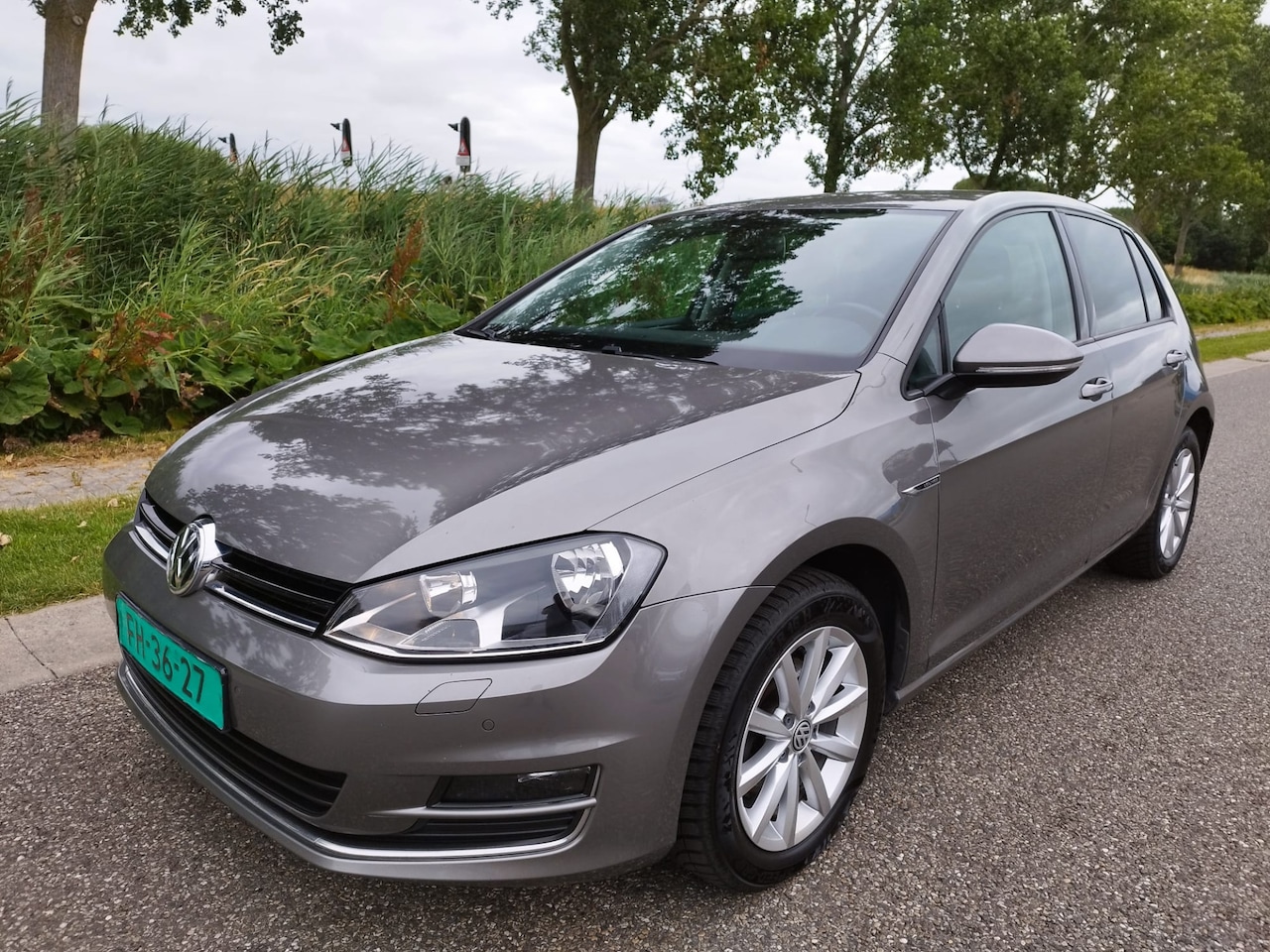 Volkswagen Golf - 1.2 TSI Lounge ** 1e eig ** NAVI ** Clima ** Bluetooth ** Wi pakket ** NW STAAT ** - AutoWereld.nl