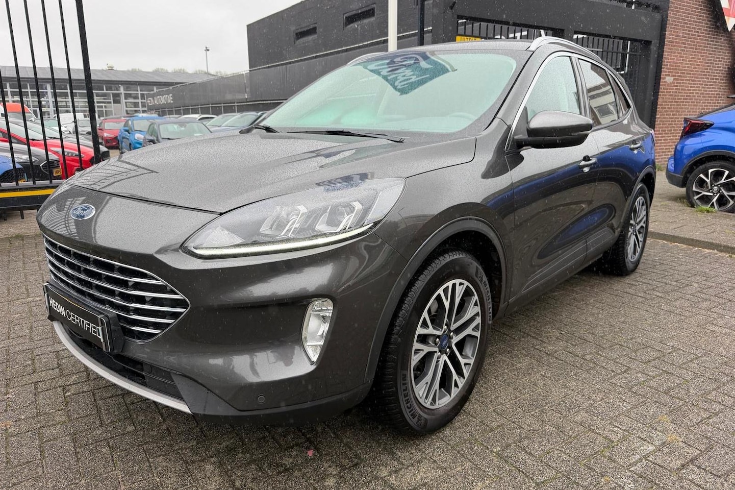 Ford Kuga - 1.5 EcoBoost Titanium | Winterpack | Trekhaak | Camera | All Season | Keyless entry - AutoWereld.nl