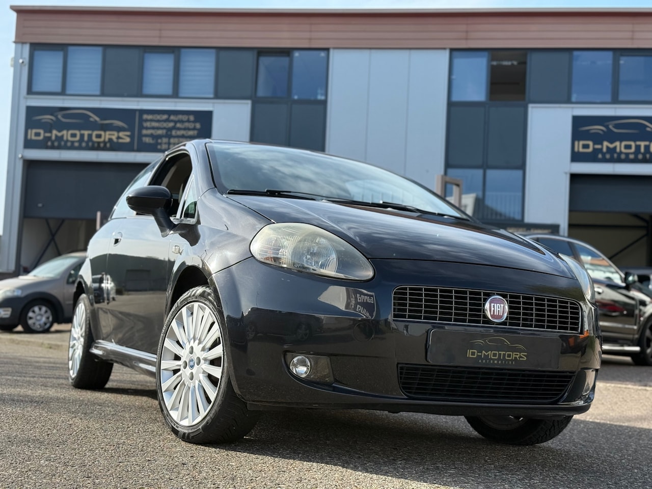 Fiat Grande Punto - 1.4-16V Edizione Lusso carplay nap airco - AutoWereld.nl
