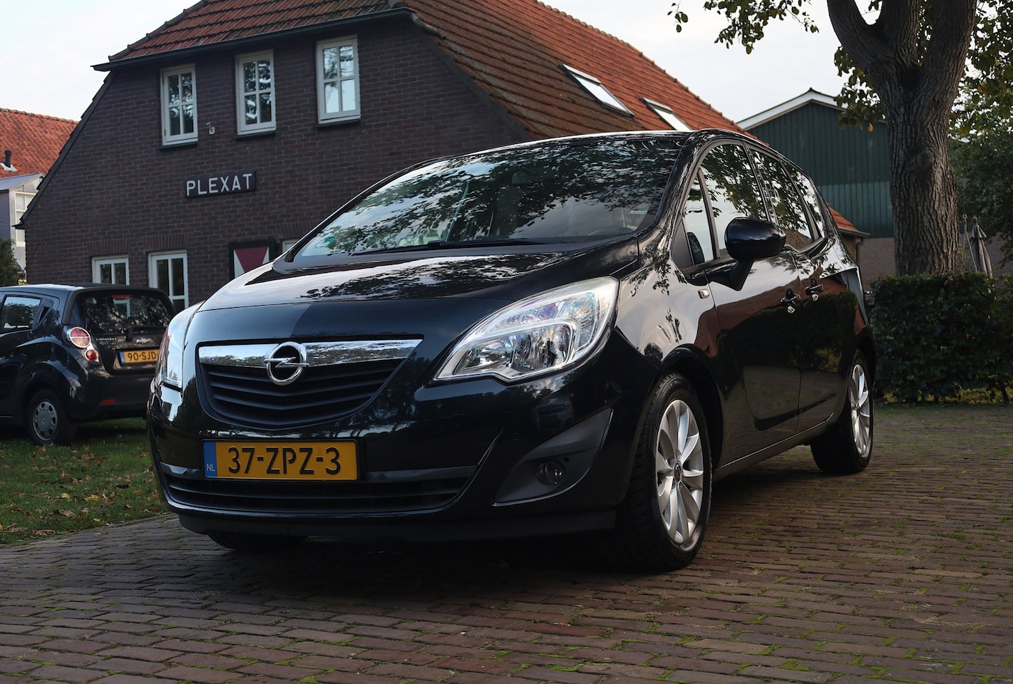 Opel Meriva - 1.4 Turbo Anniversary Edition Aut | Airco | Trekhaak | Lichtmetaal | Navigatie | Parkeerse - AutoWereld.nl