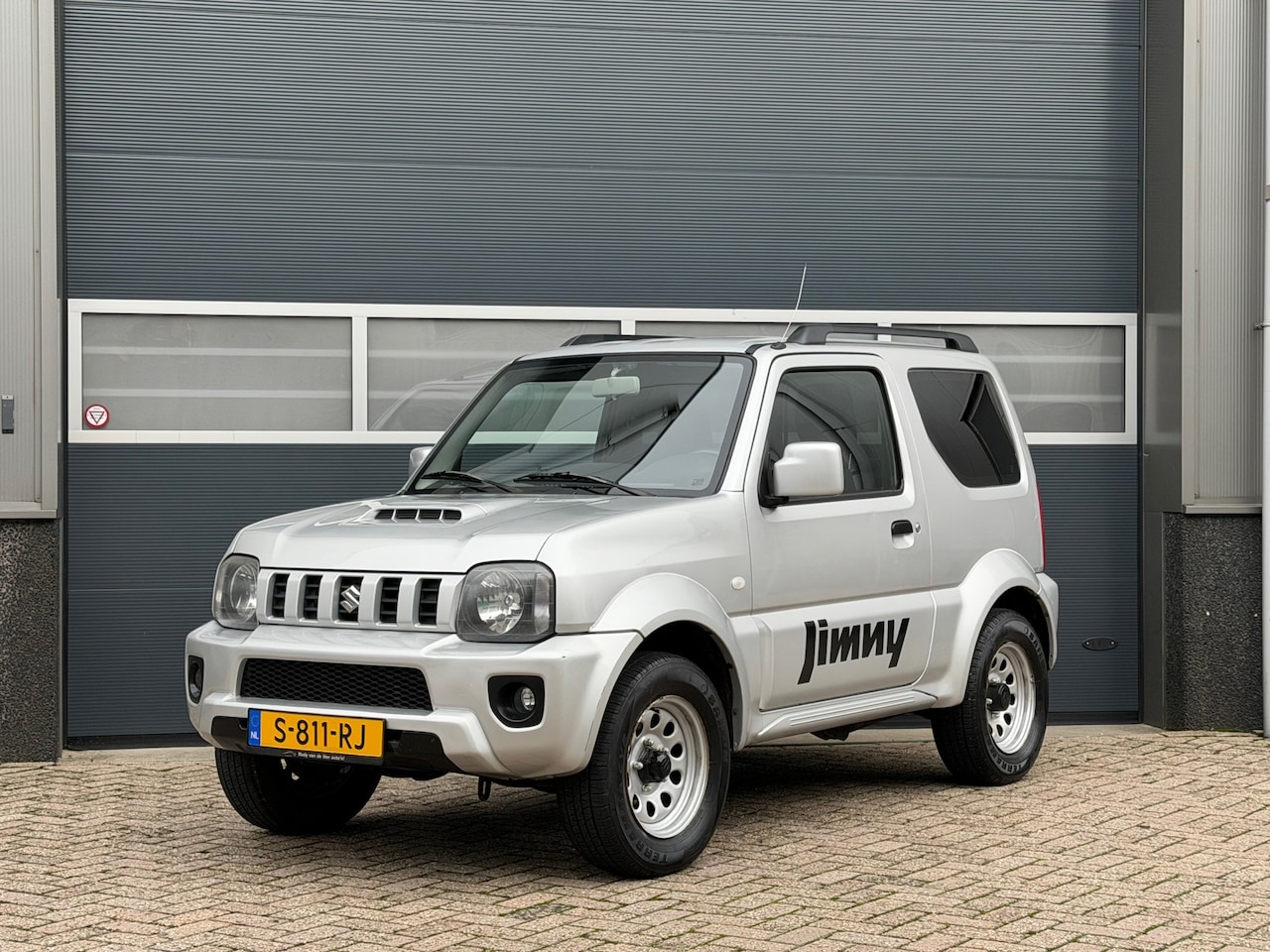 Suzuki Jimny - 1.3 JLX bj.2014 Airco|4Wd|Trekh|Stoelverw. - AutoWereld.nl