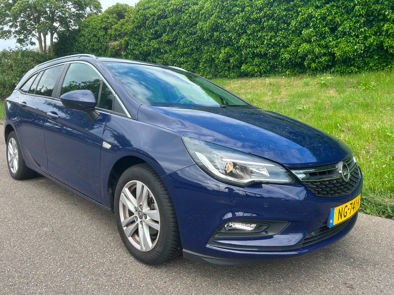 Opel Astra Sports Tourer - 1.0 Business+ Navi - Airco - Cruise - PDC - Trekhaak - AutoWereld.nl
