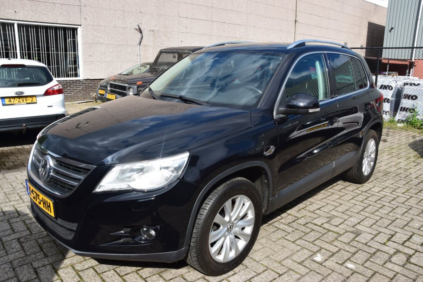 Volkswagen Tiguan - 1.4 TSI Comfort&Design 4Motion,opendak,leer. - AutoWereld.nl