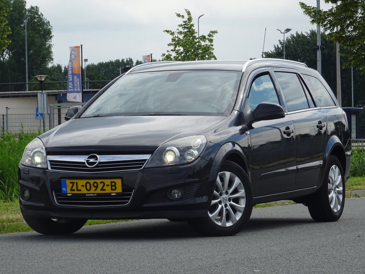 Opel Astra Wagon - 1.8 Cosmo AUTOMAAT LEER/XENON/AC/CRUISE/PDC - AutoWereld.nl