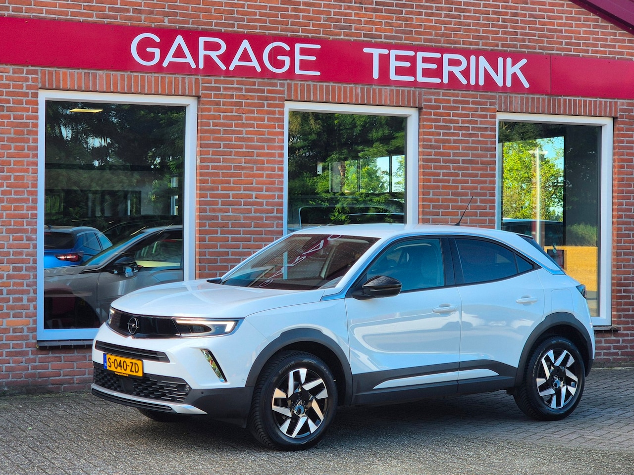 Opel Mokka - 1.2 Level 3 101PK 5drs clima, cruise, navi, keyless, camera, pdc, trekhaak, lmv, LED - AutoWereld.nl