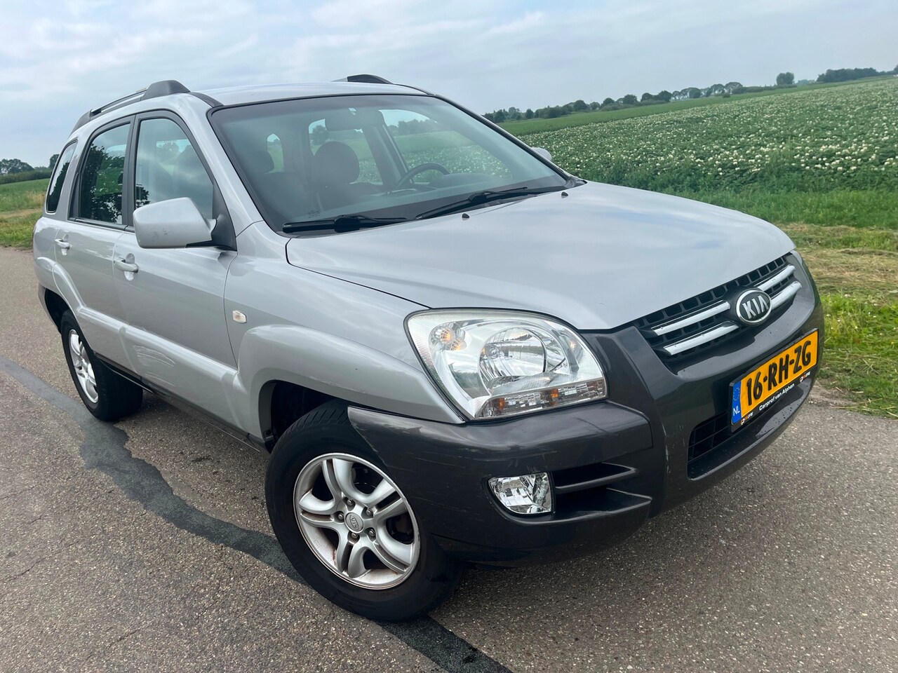 Kia Sportage - 2.0 CVVT Executive 2.0 CVVT Executive - AutoWereld.nl