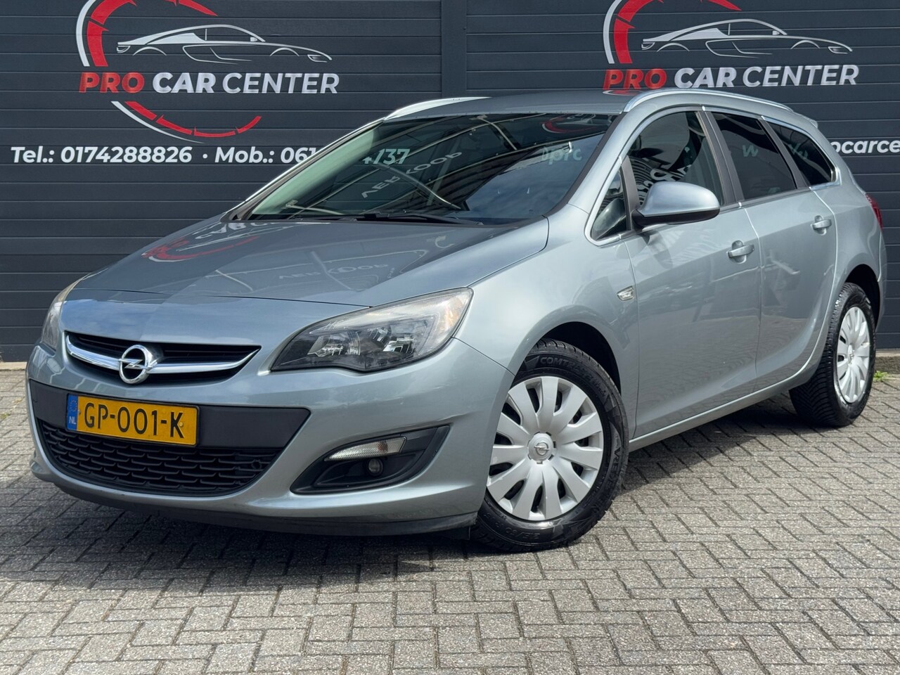 Opel Astra Sports Tourer - 1.4 Turbo Edition AIRCO | CRUISE | PDC | NAVI | EL.RAMEN | NAP | APK - AutoWereld.nl
