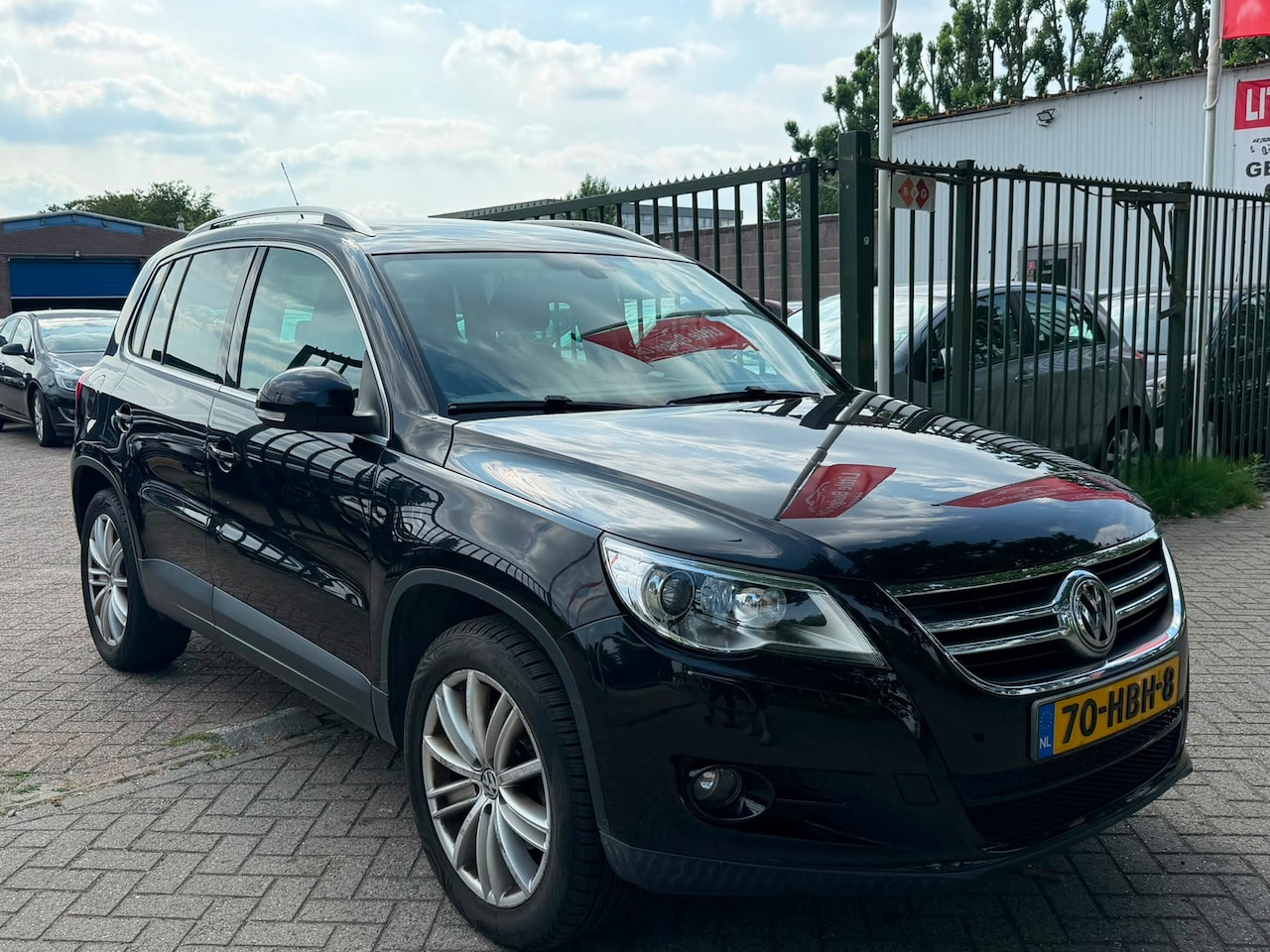 Volkswagen Tiguan - 1.4 TSI Sport&Style 4Motion 2e eigenaar dealer onderhouden Airco elektrische ramen cv op a - AutoWereld.nl