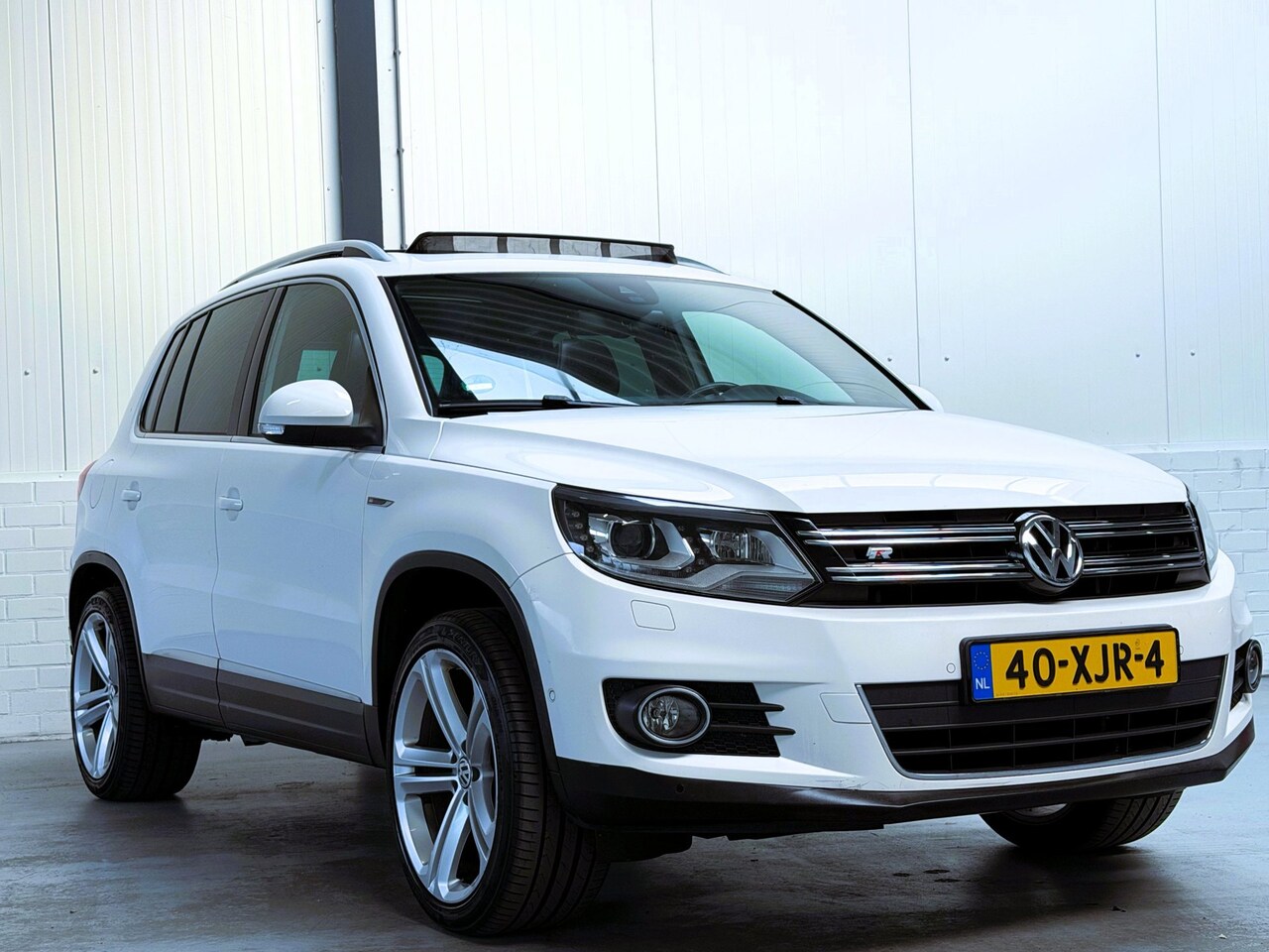 Volkswagen Tiguan - 1.4 TSI Sport&Style|Pano|Leder|Trekhaak|Goed onderhouden - AutoWereld.nl