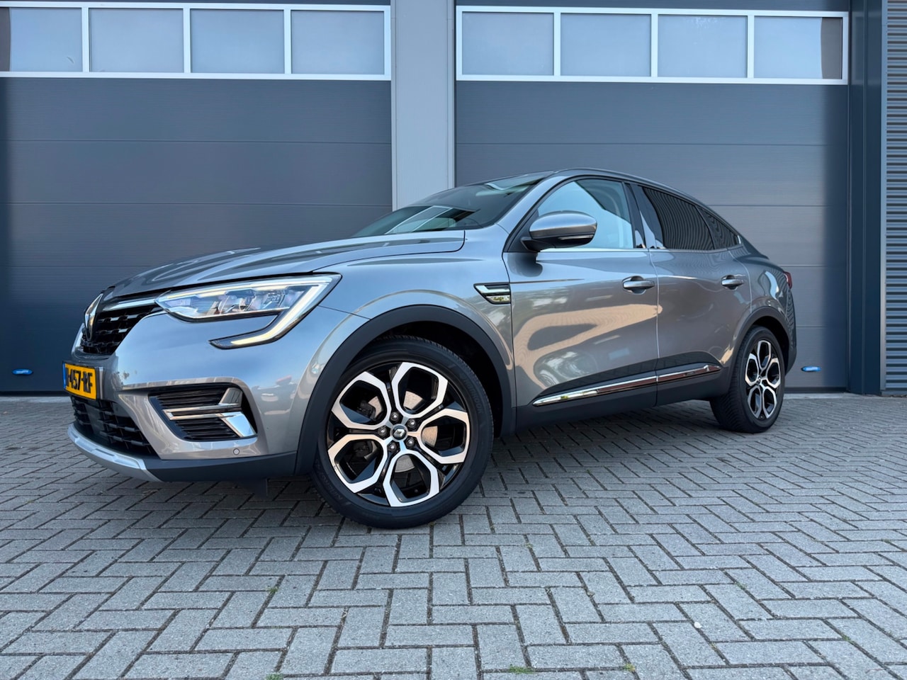 Renault Arkana - 1.6 E-Tech Hybrid 145 Intens|Dealeronderhouden|Trekhaak|All Season - AutoWereld.nl