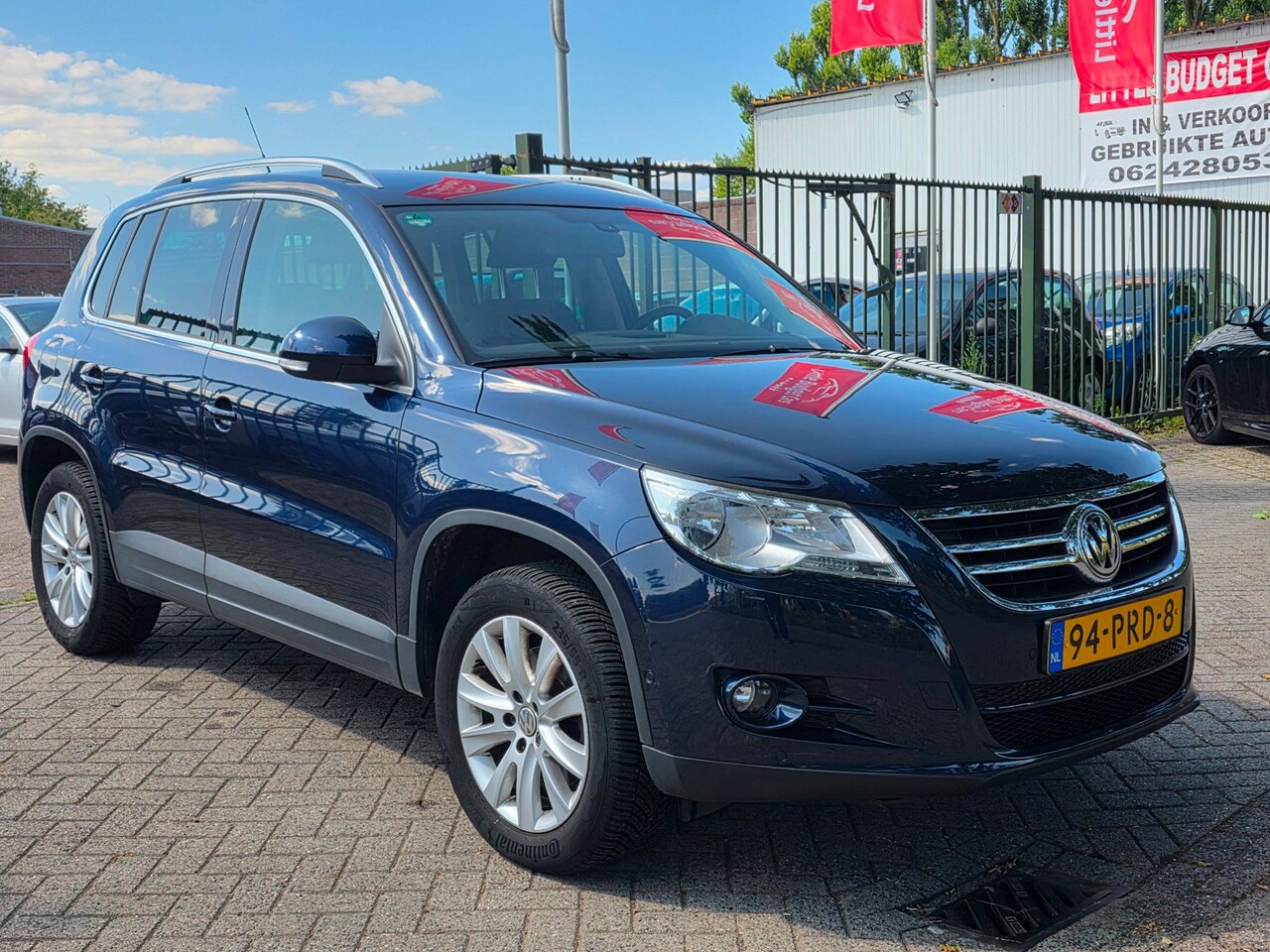Volkswagen Tiguan - 1.4 TSI Sport&Style 1e eigenaar volledig dealer onderhouden uniek km org nl auto trekhaak - AutoWereld.nl