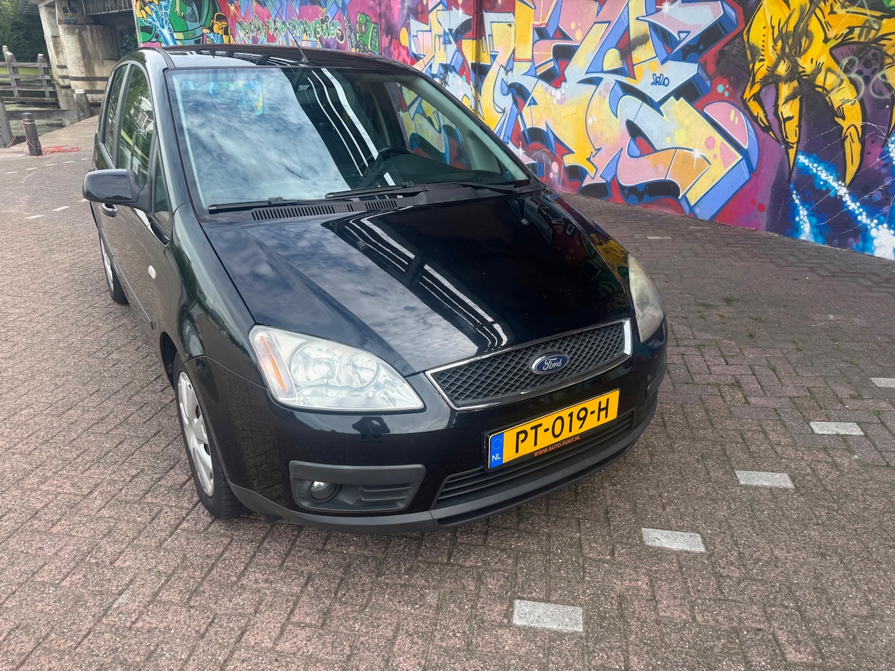Ford Focus C-Max - 2.0-16V Trend nette auto werkende airco elektrische ramen zonne schermen apk aug 2027 - AutoWereld.nl
