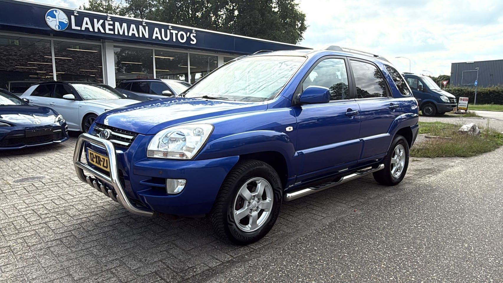 Kia Sportage - 2.0 CVVT Comfort Blueline Airco Bullbars Huurkoop Inruil APK Garantie - AutoWereld.nl