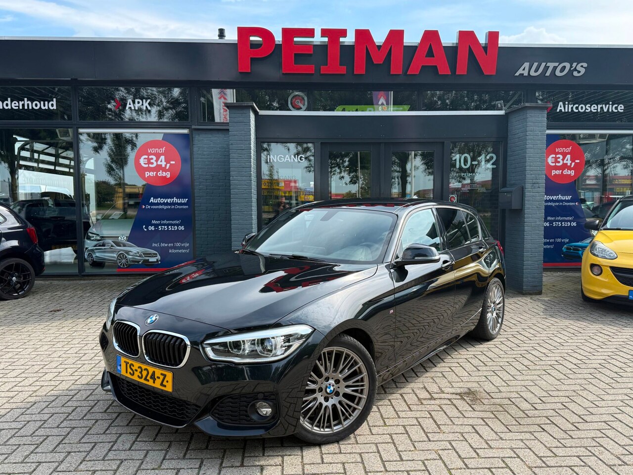 BMW 1-serie - 118i High Executive | M Sport shadow | Stoelverwarming | Climate control |Navigatie | DAB - AutoWereld.nl