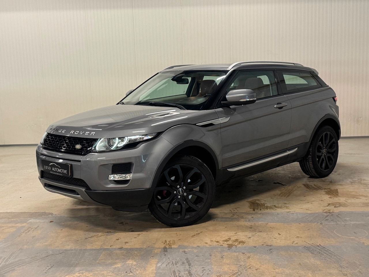 Land Rover Range Rover Evoque Coupé - 2.0 Si 4WD Prestige | ZONNEDAK | MERIDIAN | CAMERA | LEDER - AutoWereld.nl