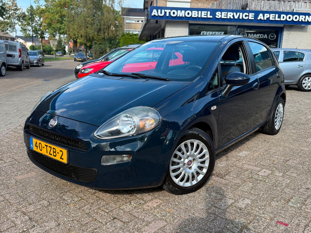 Fiat Punto Evo - 1.3 M-Jet Easy * NL AUTO*NW. APK* 5DRS*AIRCO*CRUISE*AUX*MF STUUR*TREKHAAK * - AutoWereld.nl