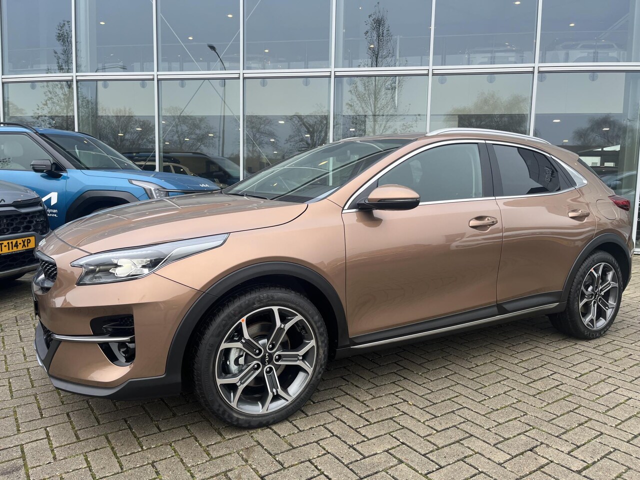Kia XCeed - 1.0 T-GDi DynamicPlusLine keyless | stoel/stuur verwarming | elek. achterklep | Apple carp - AutoWereld.nl