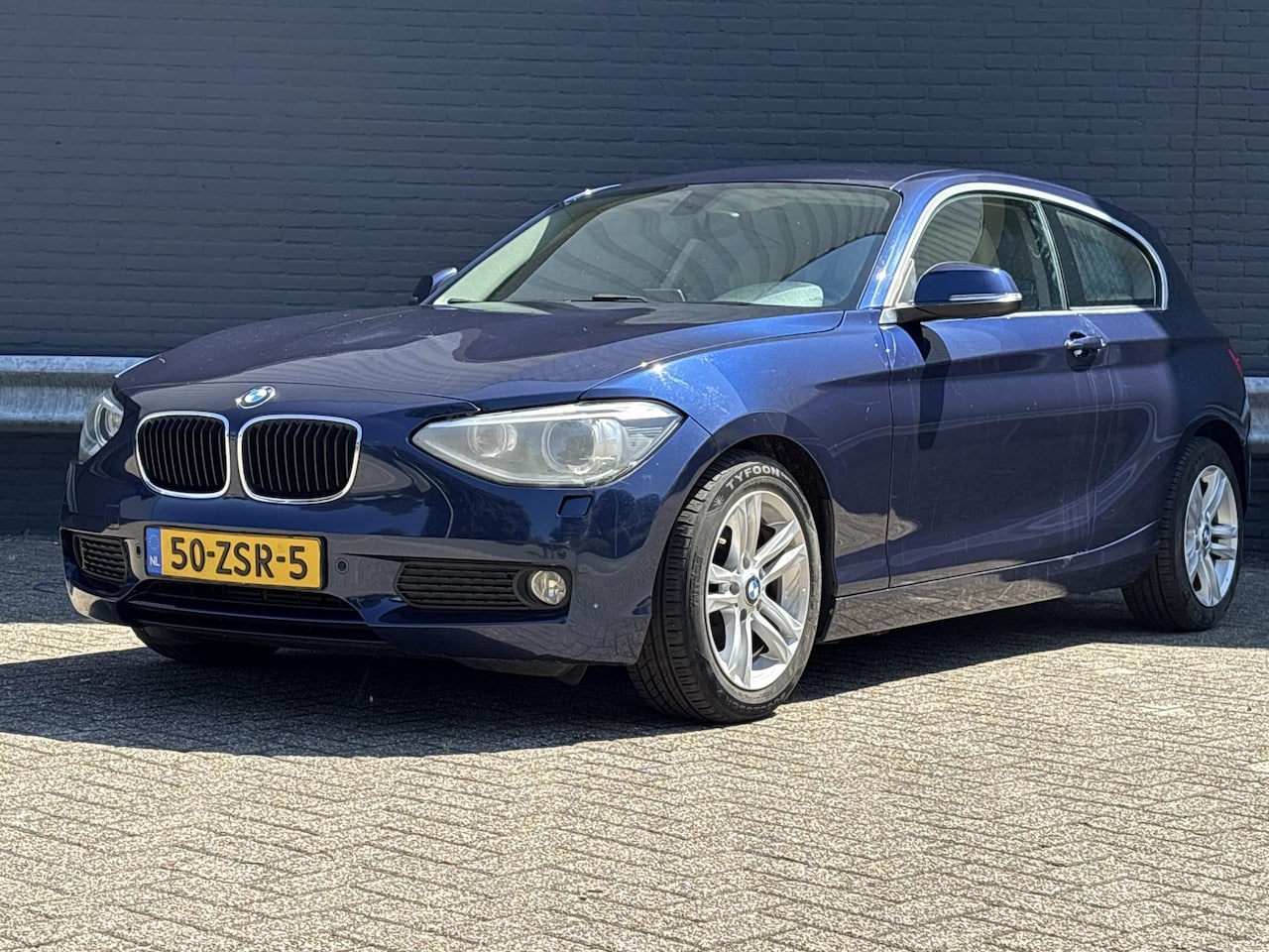 BMW 1-serie - 114i EDE Business+ | Leder | Climate | Cruise | Navi | PDC | - AutoWereld.nl