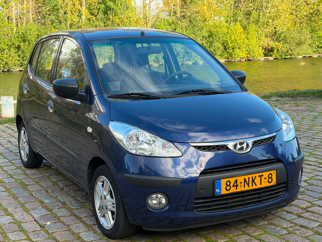 Hyundai i10 - 1.1 Active Orange Babies 2e eigenaar airco elektrische ramen - AutoWereld.nl