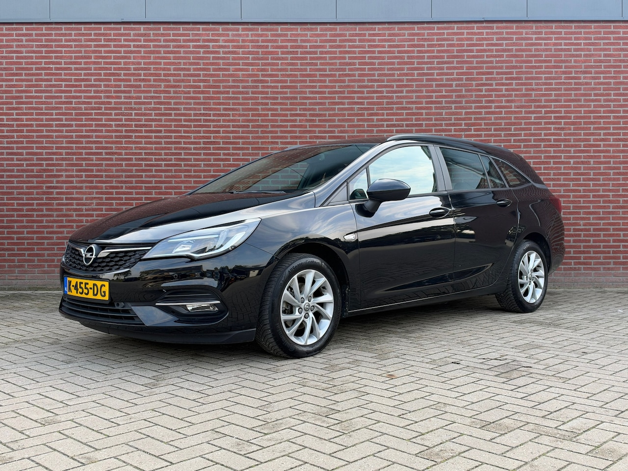 Opel Astra Sports Tourer - 1.2 Business Edition / Nap / Airco / Cruise / Trekhaak - AutoWereld.nl