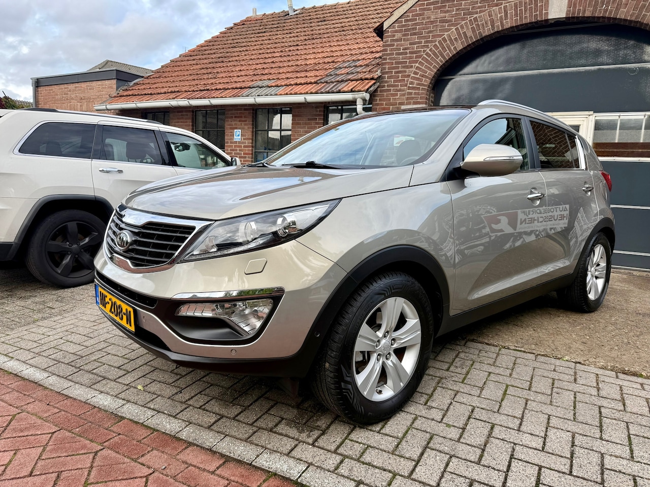 Kia Sportage - 1.6 GDI ISG X-clusive I CLIMATE I CRUISE I CAMERA I LEDER I PANO I - AutoWereld.nl