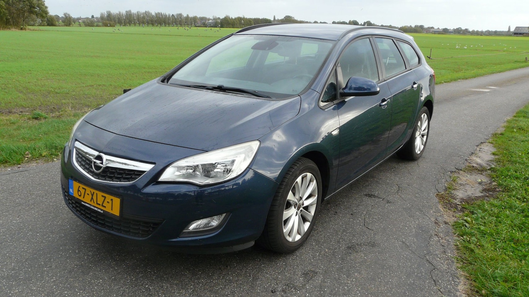 Opel Astra Sports Tourer - 1.4 Turbo Sport 1.4 Turbo Sport,Airco,Elec.pakket,Grootbeeld Navi,Lmv's,Trekhaak! - AutoWereld.nl