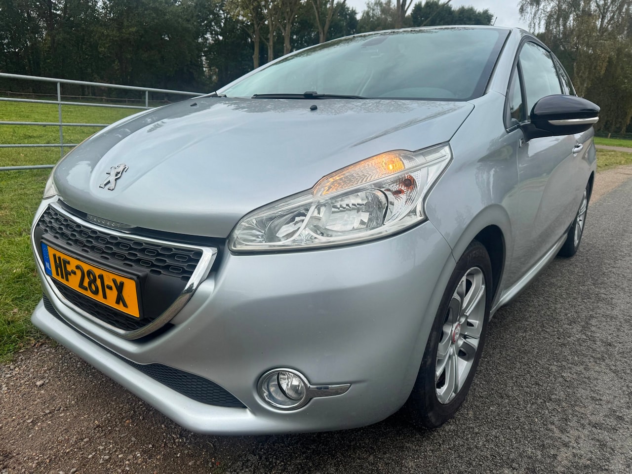 Peugeot 208 - 1.2 VTi Envy navigatie|climate control|cruise control|half leder - AutoWereld.nl