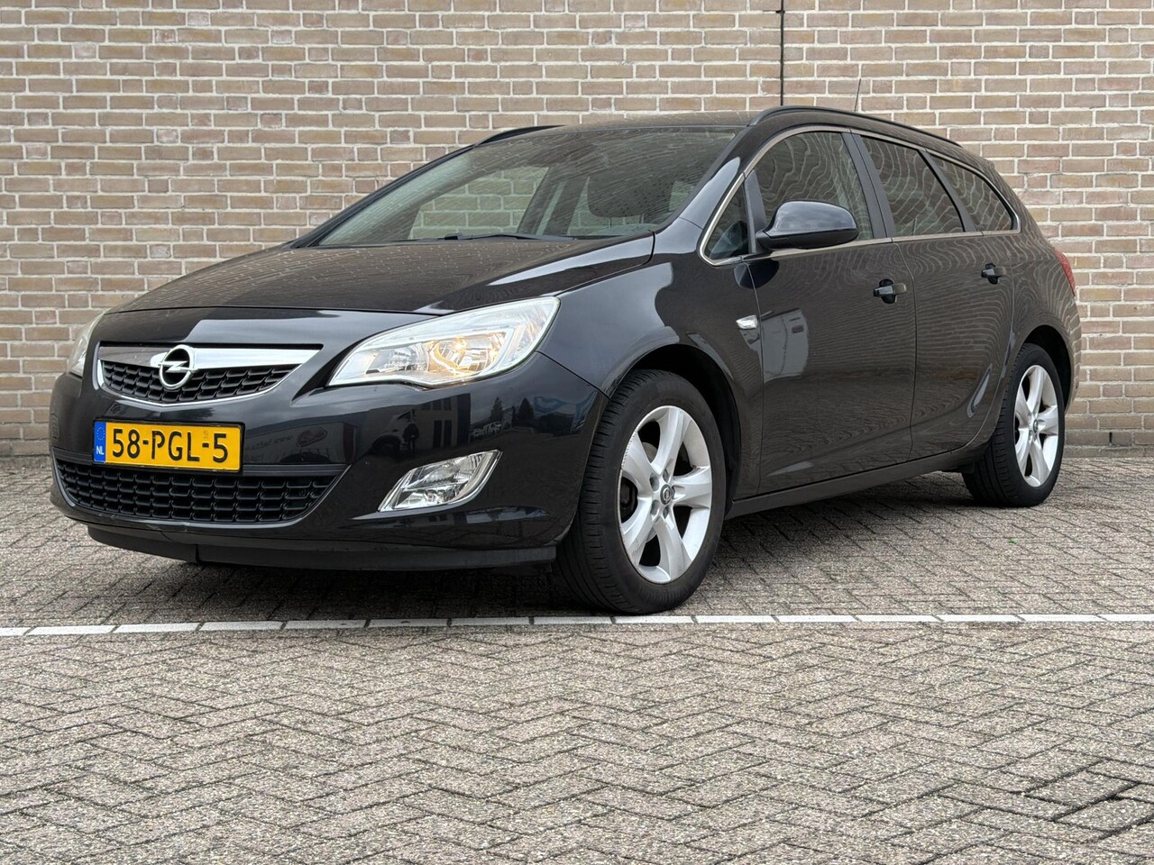 Opel Astra Sports Tourer - 1.4 Turbo Edition | Cruise | Airco | - AutoWereld.nl