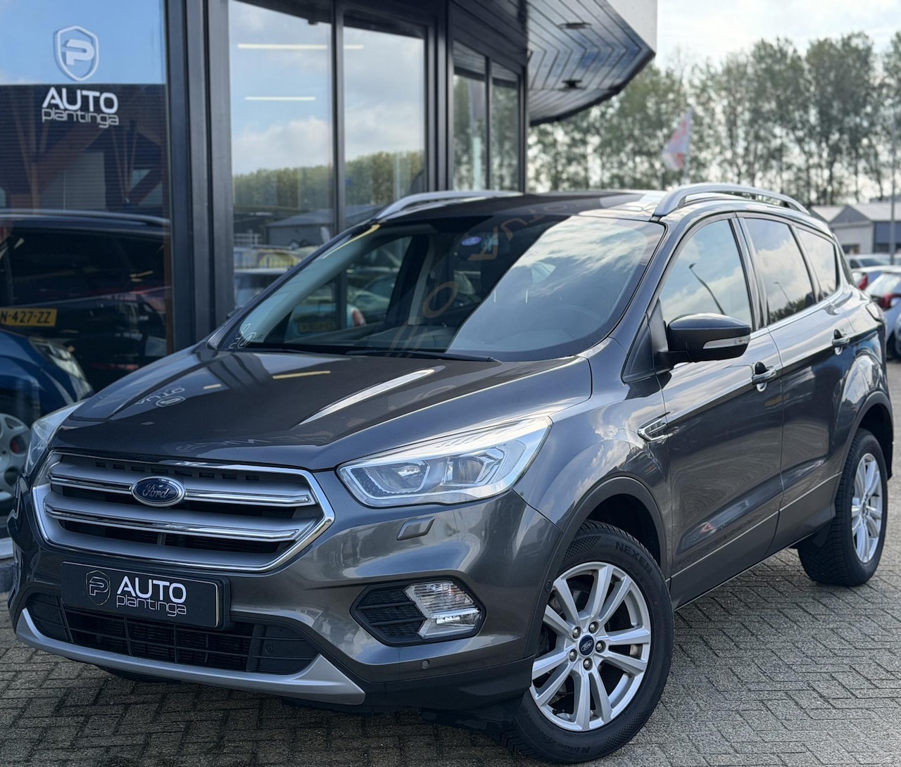 Ford Kuga - 1.5 EcoBoost Titanium 150PK | Volledige Onderhoudshistorie | Trekhaak | Navigatie | Stoelv - AutoWereld.nl