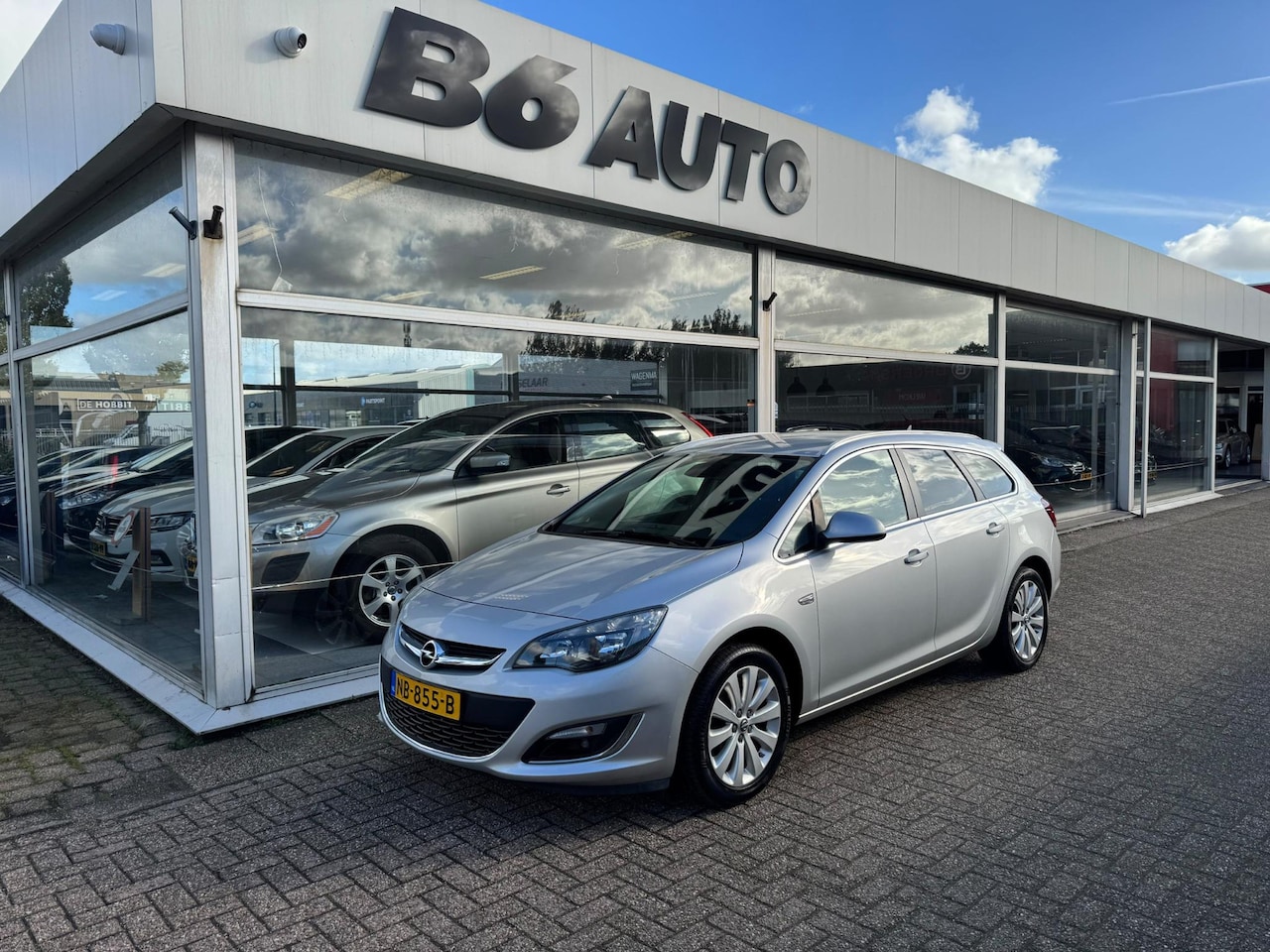 Opel Astra Sports Tourer - 1.4 Edition | 2e eigenaar | Cruise control | Elektrische ramen | Climate control | Trekhaa - AutoWereld.nl