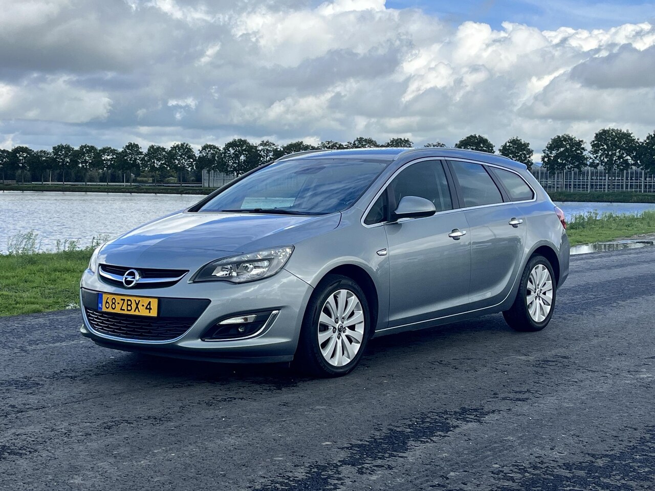 Opel Astra Sports Tourer - 1.4 Turbo Sport Clima, cruise, pdc achter, trekhaak - AutoWereld.nl