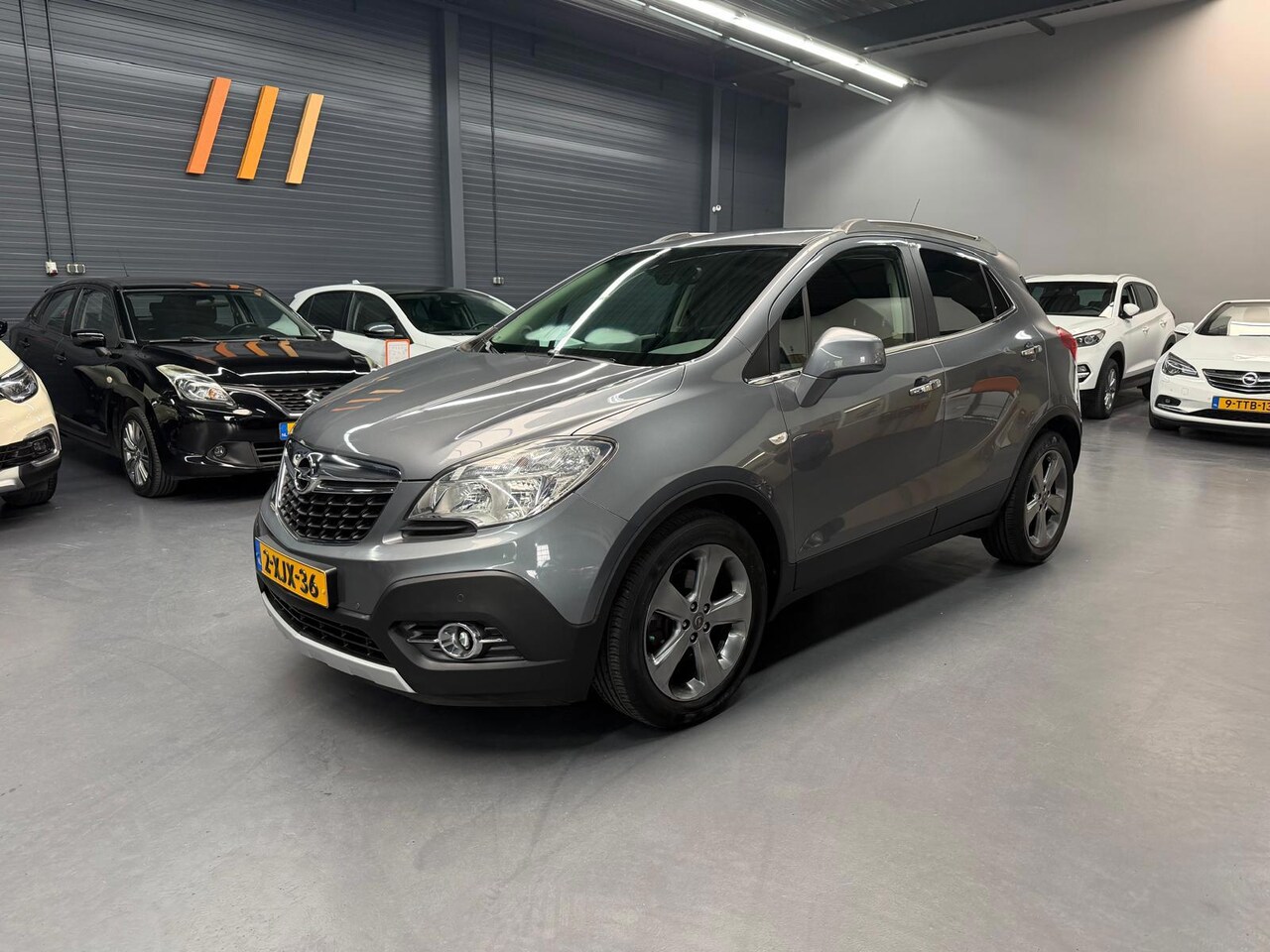 Opel Mokka - 1.4 T Cosmo 1E EIGENAAR CAMERA LEDER TREKHAAK NAP NL AUTO - AutoWereld.nl
