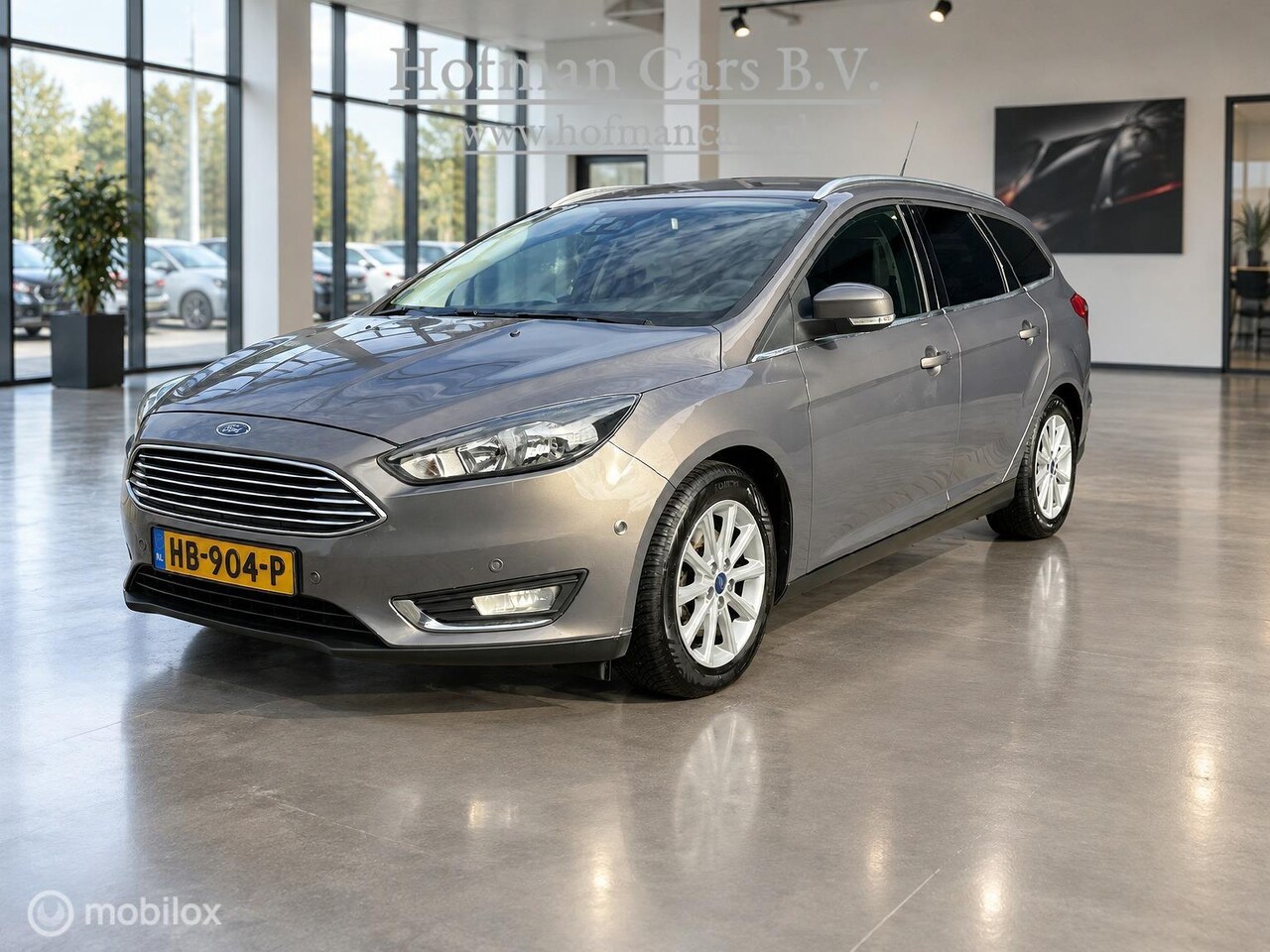 Ford Focus Wagon - 1.5 Titanium Edition | TREKHAAK 1.500 KG | HALF LEDER | AUTOMATISCH INPARKEREN | EXTRA SET - AutoWereld.nl