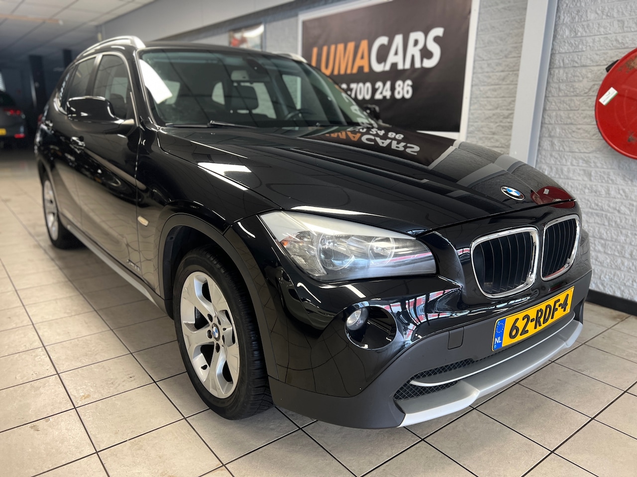 BMW X1 - SDrive18i Executive | NW APK | Cruise | Navi | PDC | - AutoWereld.nl