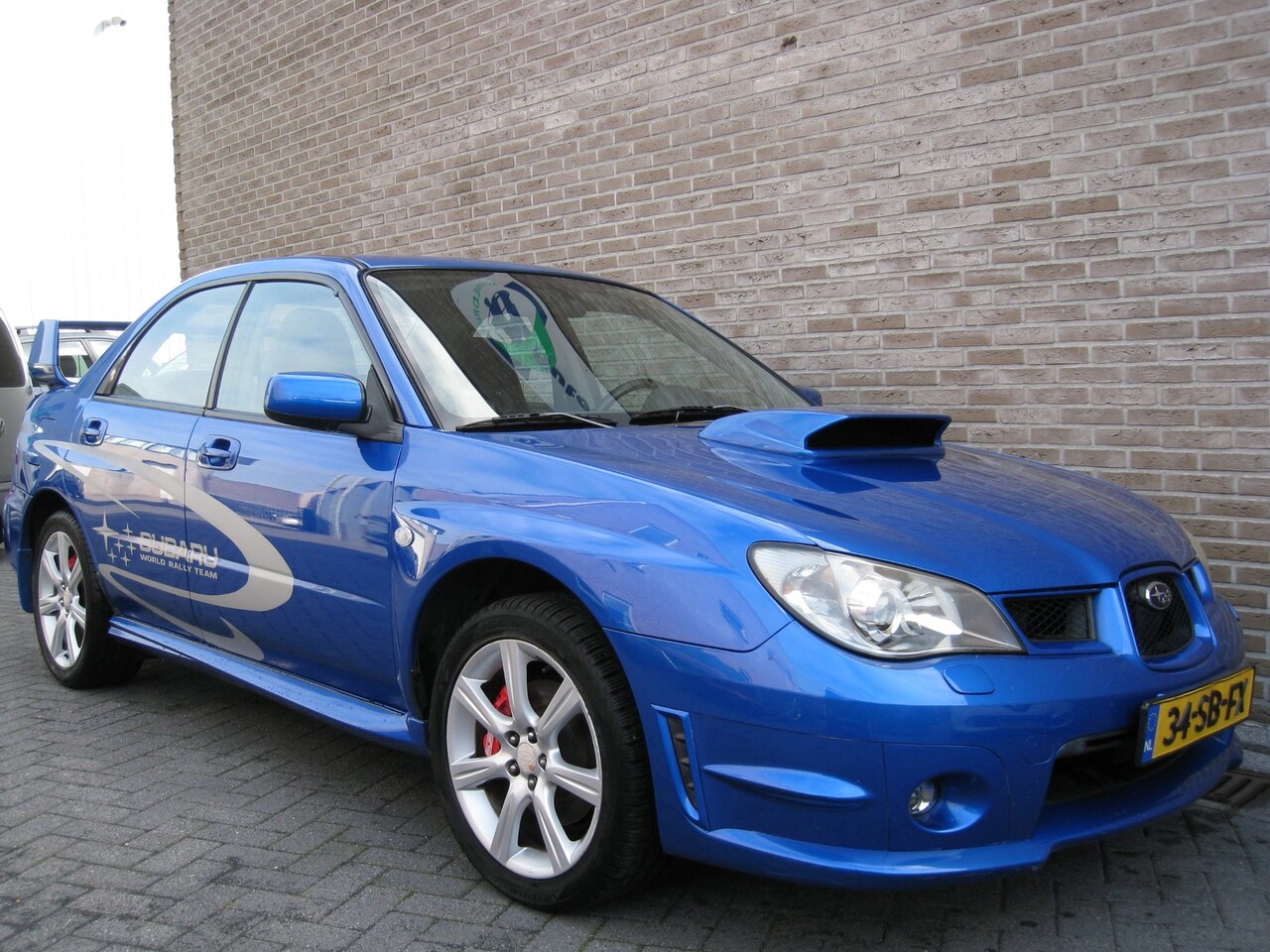 Subaru Impreza - 2.5 WRX - Sportstoelen - Radio-/CD speler - Climate control - Skiluik - AutoWereld.nl