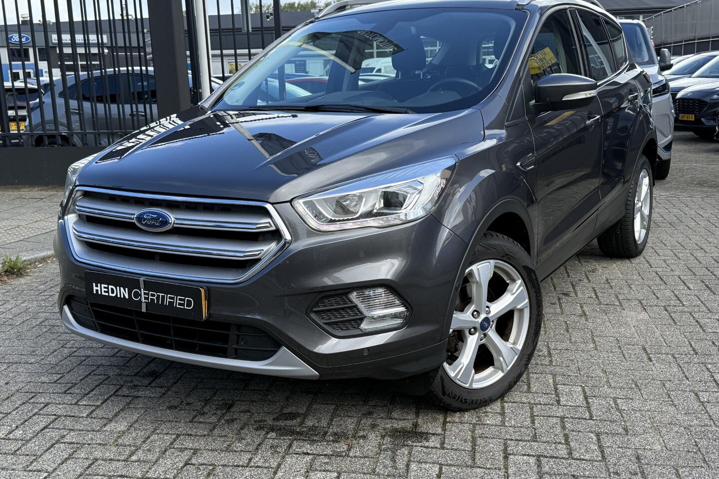 Ford Kuga - 1.5 EcoBoost Titanium | Elektrische Achterklep | Trekhaak | All season | Half Leder | Came - AutoWereld.nl