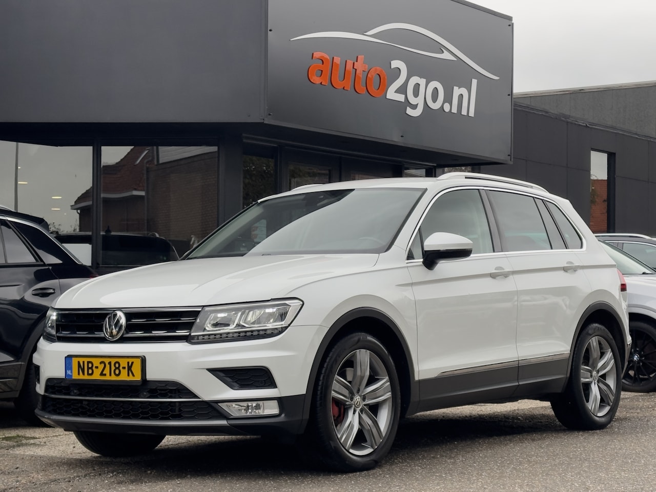 Volkswagen Tiguan - 2.0 TSI AUT7 4MOTION HIGHLINE NAVI AIRCO DIGI-DASH LED LMV PDC - AutoWereld.nl