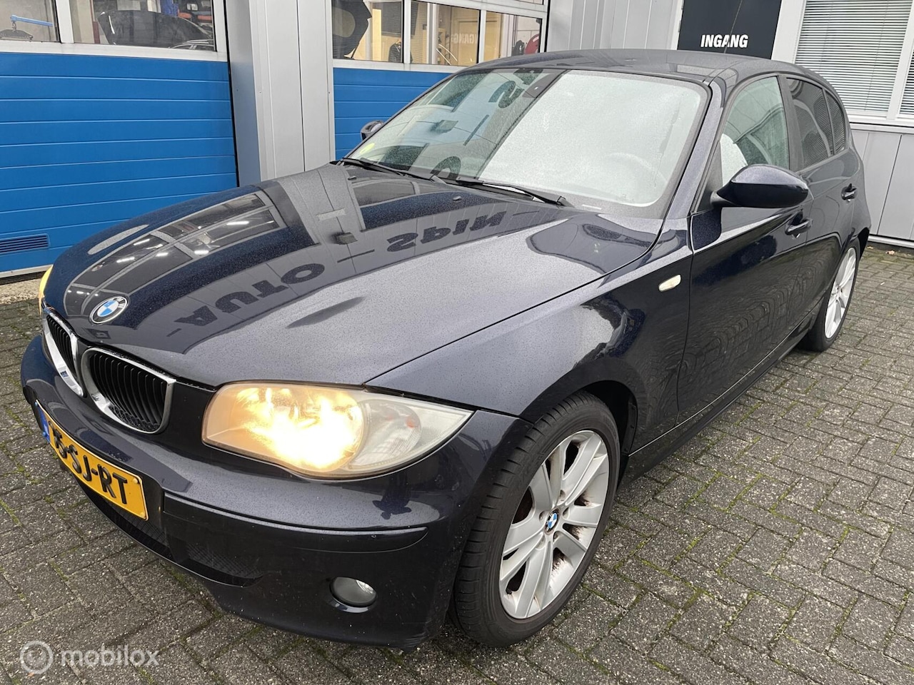 BMW 1-serie - 120i High Executive Leer-Navi.-17''Cruise-Pdc - AutoWereld.nl