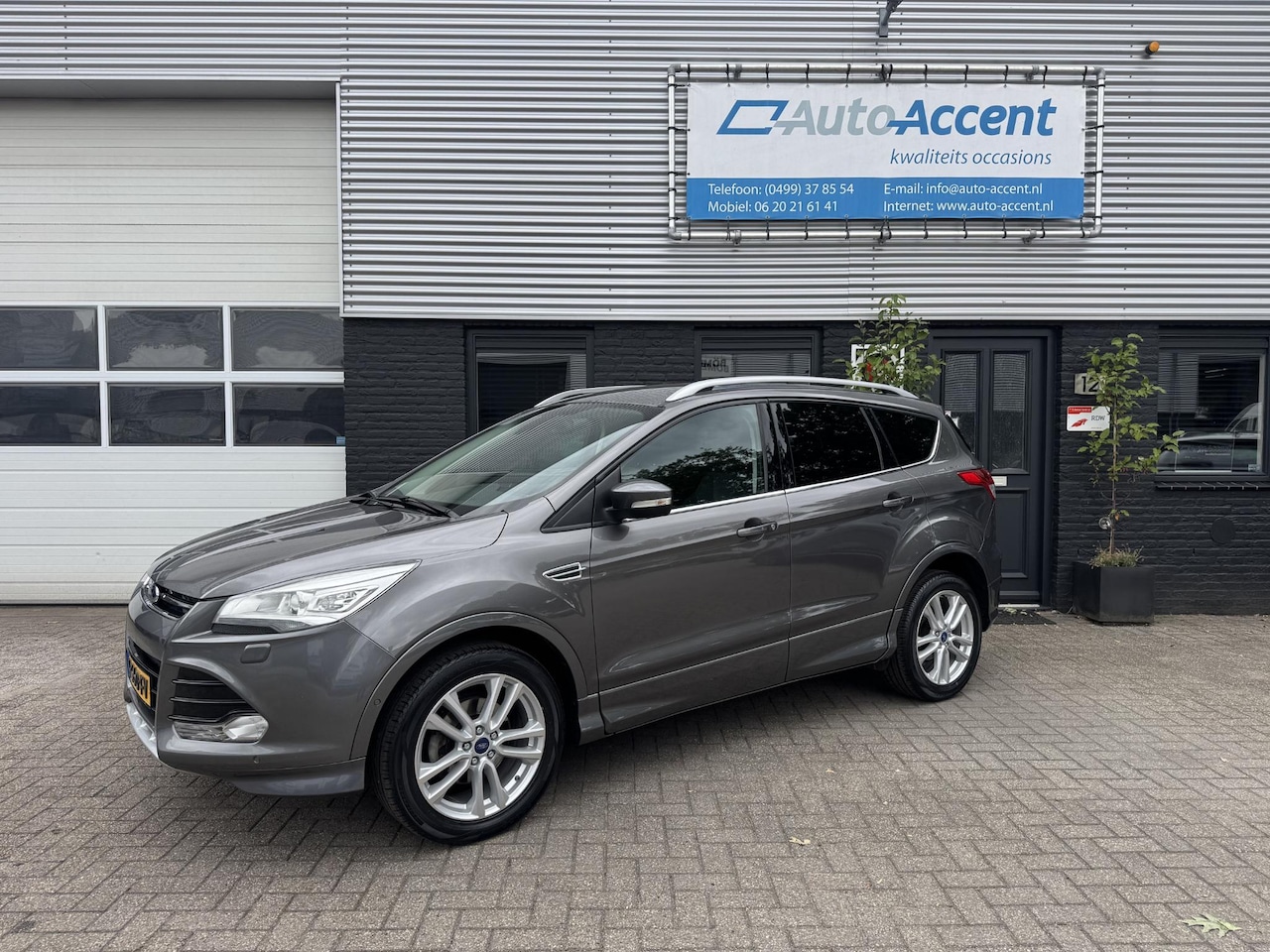 Ford Kuga - 1.6 Titanium Plus Klima/Navi/Trekhaak/156dkm... - AutoWereld.nl
